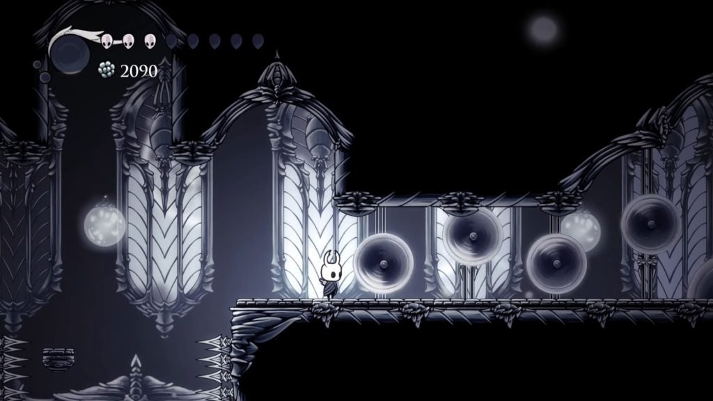 The bright and gleaming architecture of the White Palace in Hollow Knight.