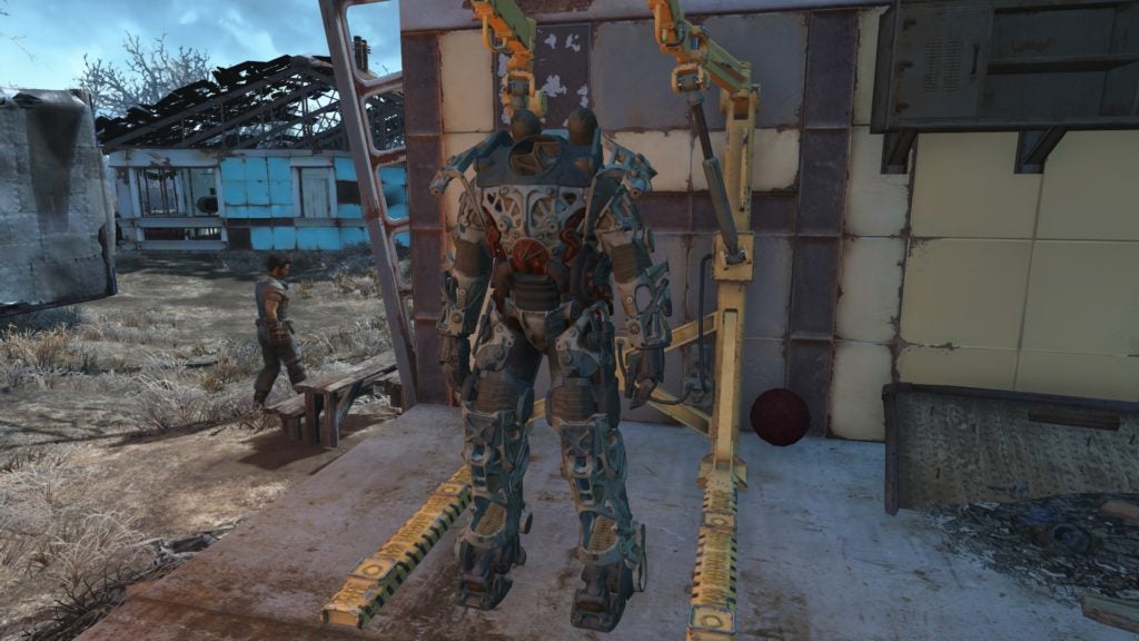 A power armor frame standing in a power armor station.