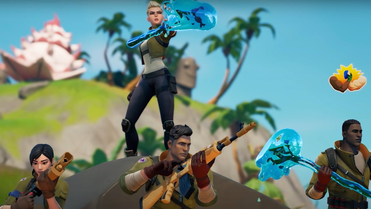 Four Fortnite characters in a team, readying their weapons.