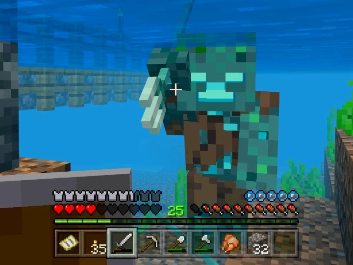A Drowned enemy attacking the player with a trident while they are both underwater.
