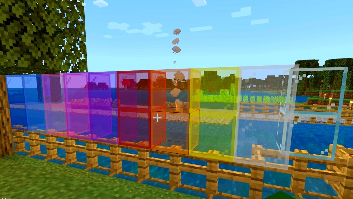 Many different colors of stained glass blocks next to each other on a fence.