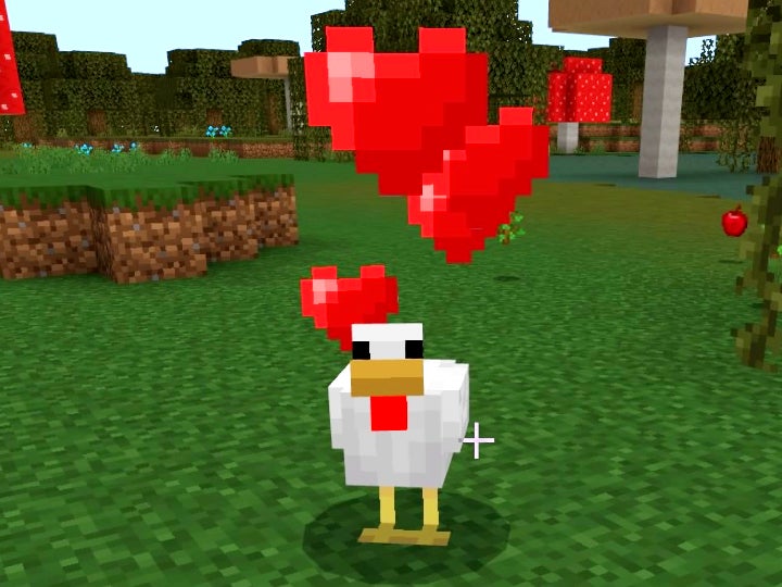 Chicken standing on some grass with red hearts over its head.