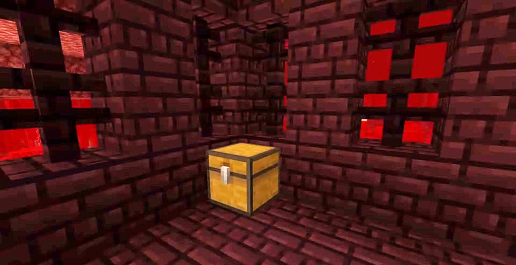 A simple yellow chest in a dark red brick room of a nether fortress.