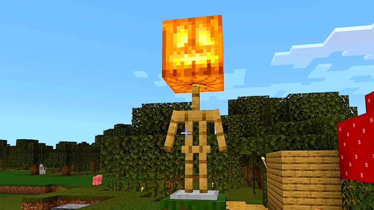 A glowing jack o'lantern on top of a wooden armor stand.