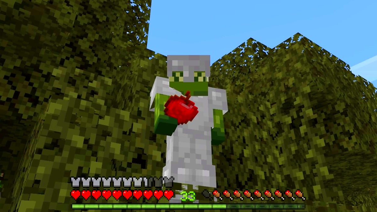 The player in third person view holding an apple in their hand. They are standing in a tree and are wearing full iron armor.