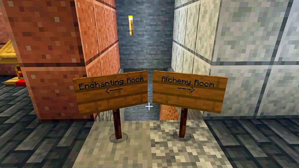 There are 2 signs in a hallway. The left one point towards the enchanting room and the right one points towards the alchemy room.
