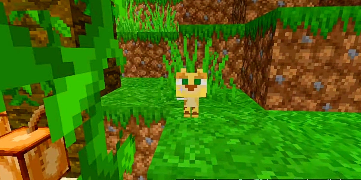 A yellow kitten ocelot looking at the player.
