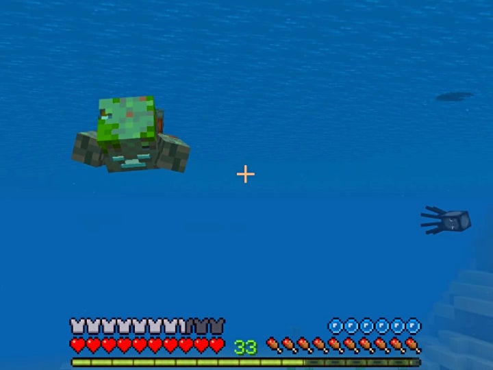 A drowned mob swimming towards the player underwater.