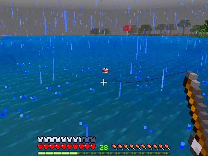 The player fishing while it is raining. The line of the rod extends to a red and white bobber floating on the water nearby.