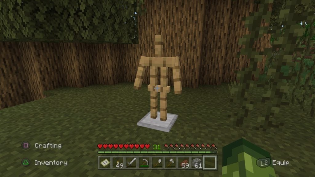 An armor stand in a grassy area by some trees. The armor stand looks like a skeletal wooden mannequin with no head.