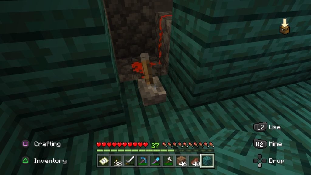 A lever connected to a redstone circuit that is surrounded by dark green wood.