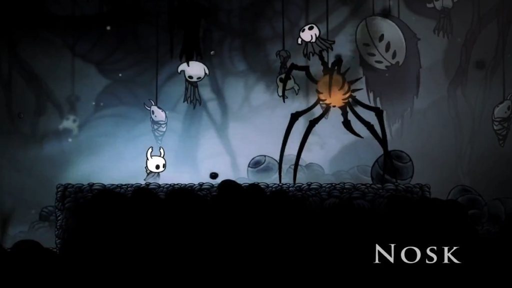 Fighting Nosk from Hollow Knight.