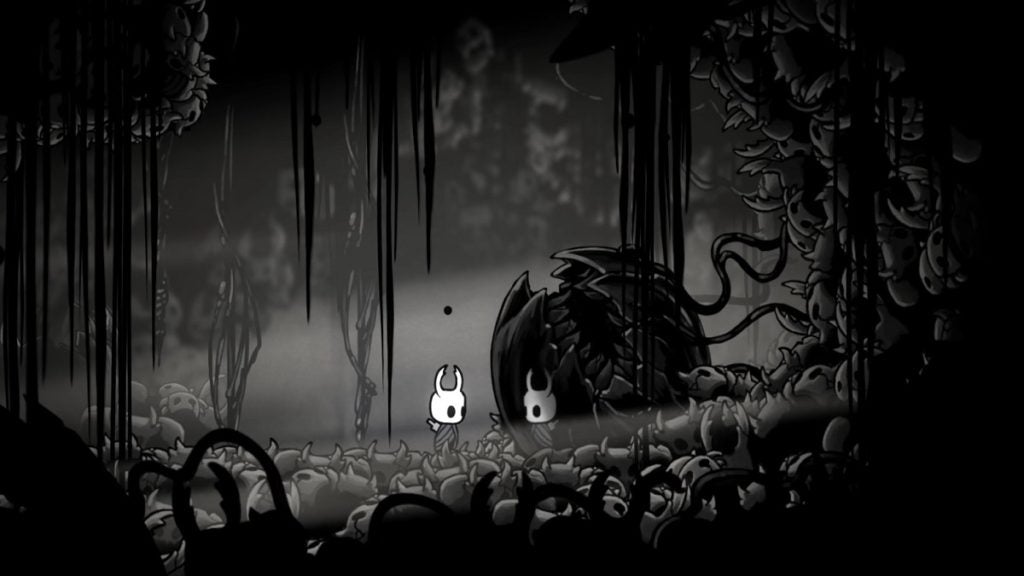 Picking up the Void Heart charm in Hollow Knight.