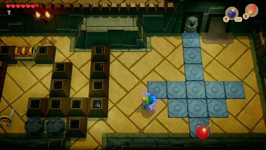 Link placing a bomb at the south wall to blow open a secret passage.