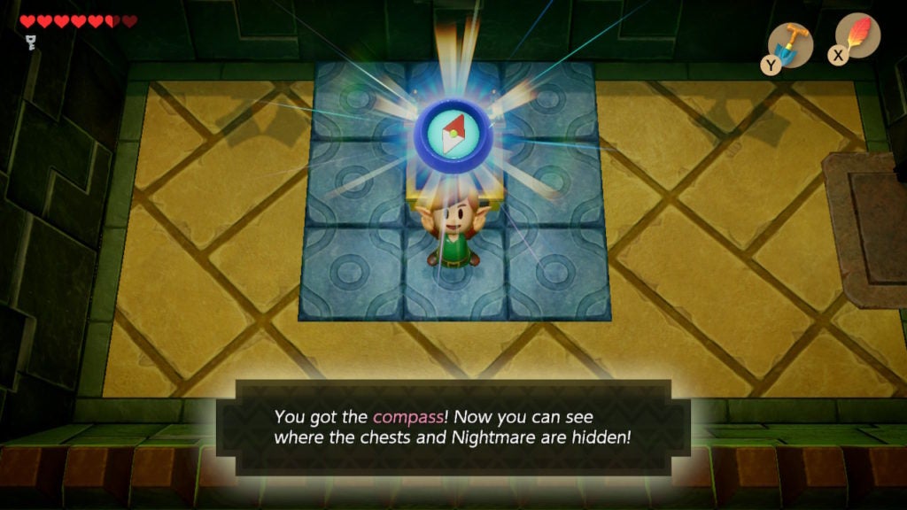 Link holding up the compass with a smile on their face.