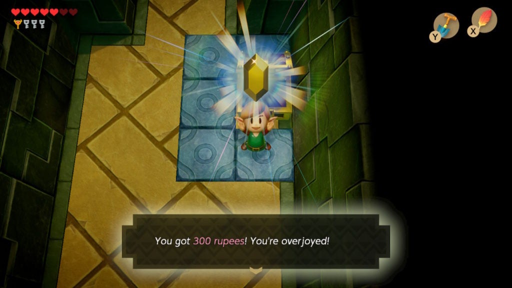 Link excitedly holding up a golden rupee.