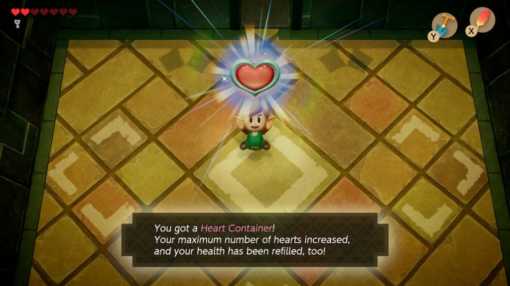 Link happily holding up a full heart container.
