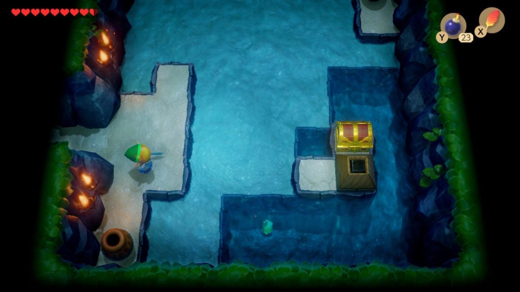 Link staring at the chest obstructed by 1 block after he blew up a cracked block next to it.
