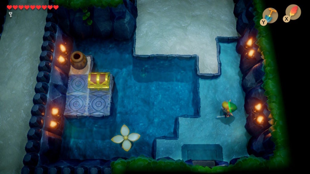 Link looking at a chest that's across a wide pool of deep water.