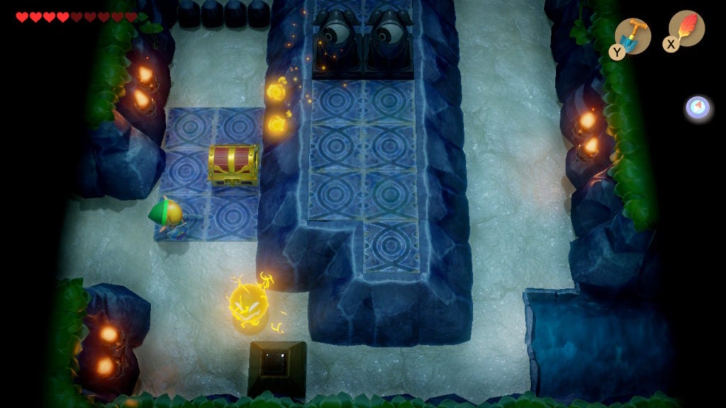 A room with 1 Spark and 2 eye statues. There is also a chest nearby.