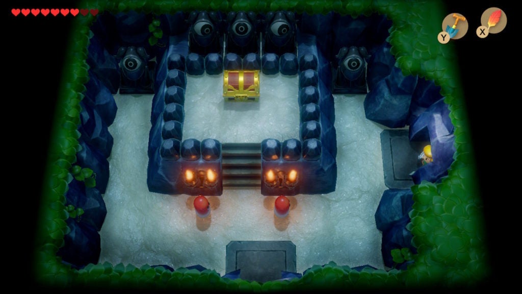 Link entering a room with a chest, 2 Red Gels, and many eye statues on the north wall.