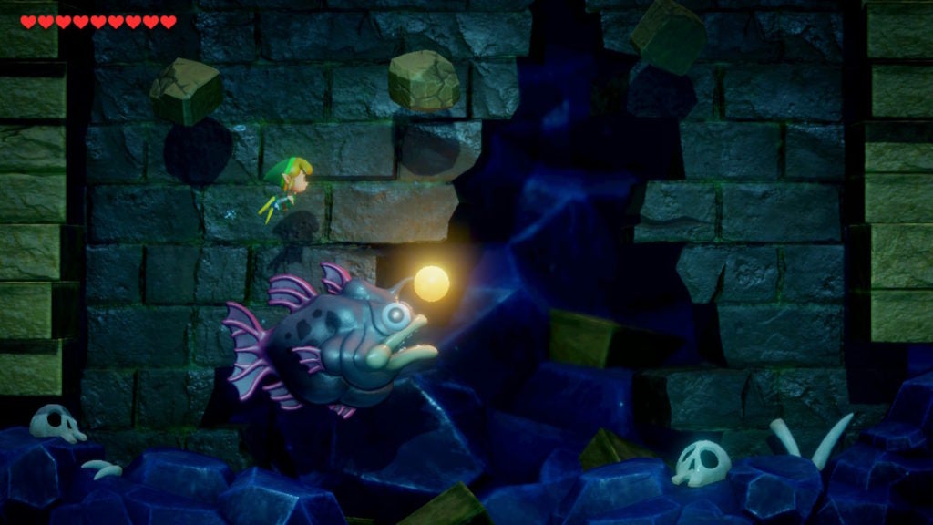 Link swimming above Angler Fish while avoiding the falling boulders.