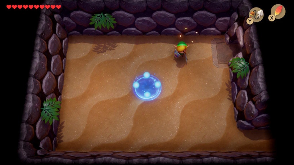 Link in a room with a blue warp point on the floor.