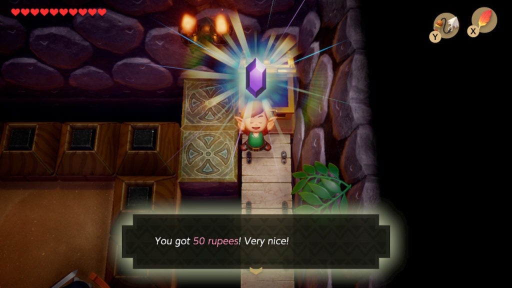 Link holding up a purple Rupee.