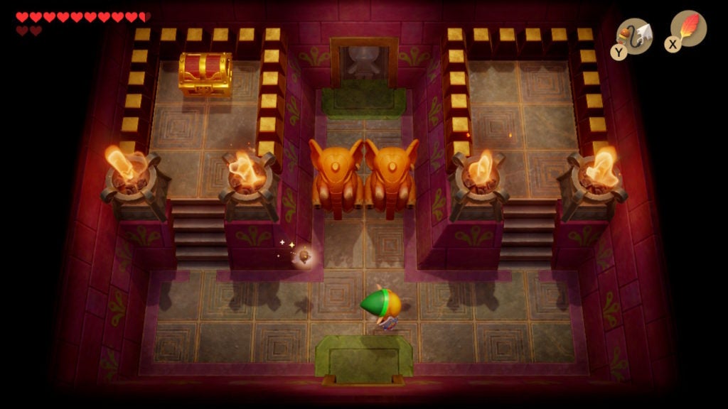 Room with 2 elephant statues in the middle and 1 chest in the northwest.