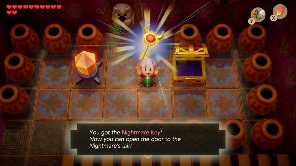 Link holding up the Nightmare Key.