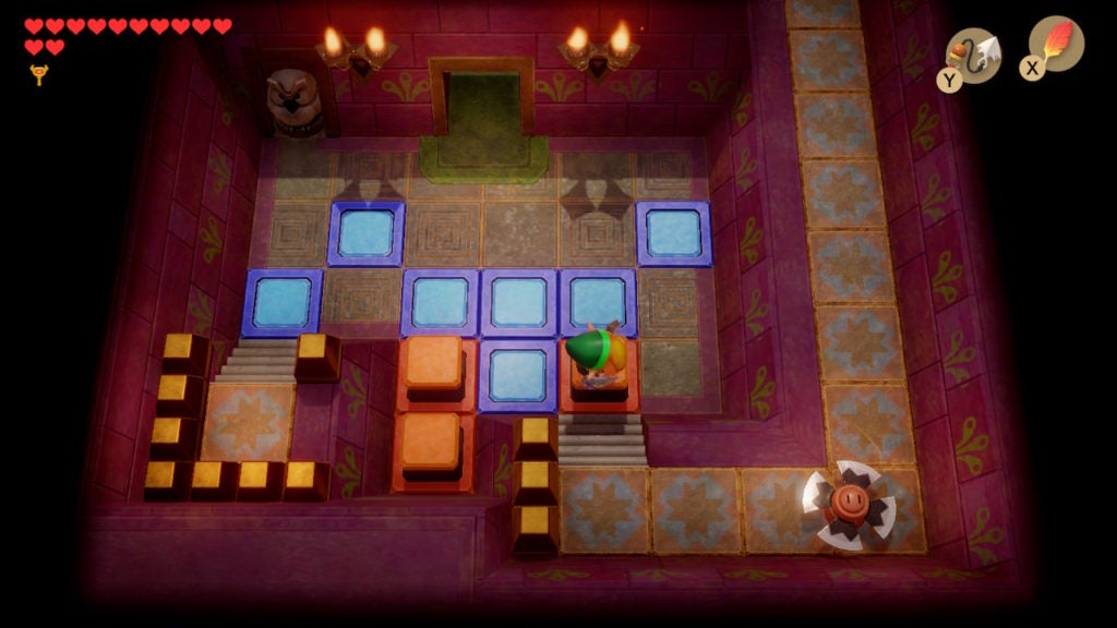 Link jumping across raised orange switch blocks to cross the room.