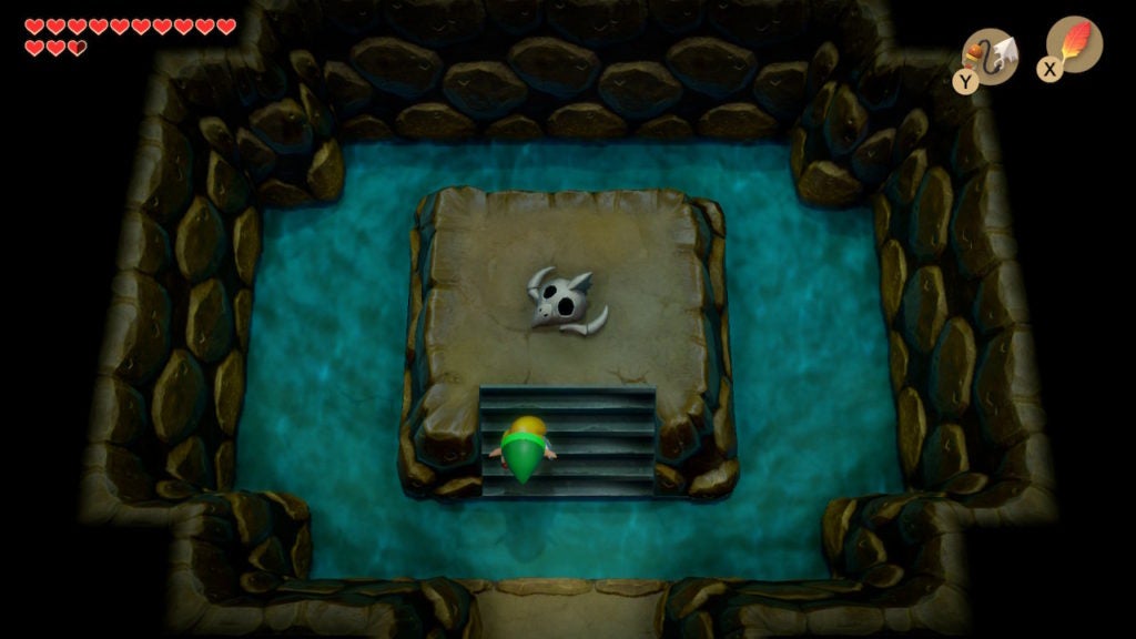 Link looking at the skeletal remains of something while underground.