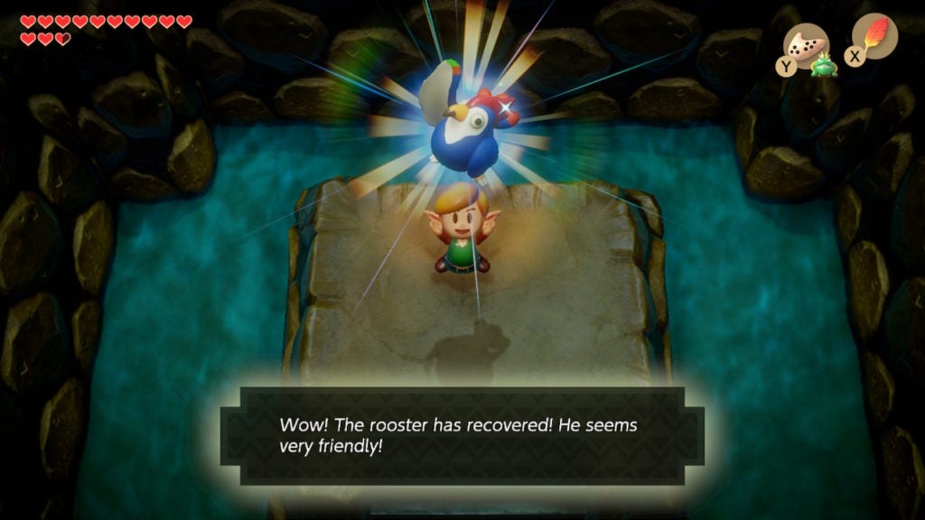 Link holding the blue rooster above his head.