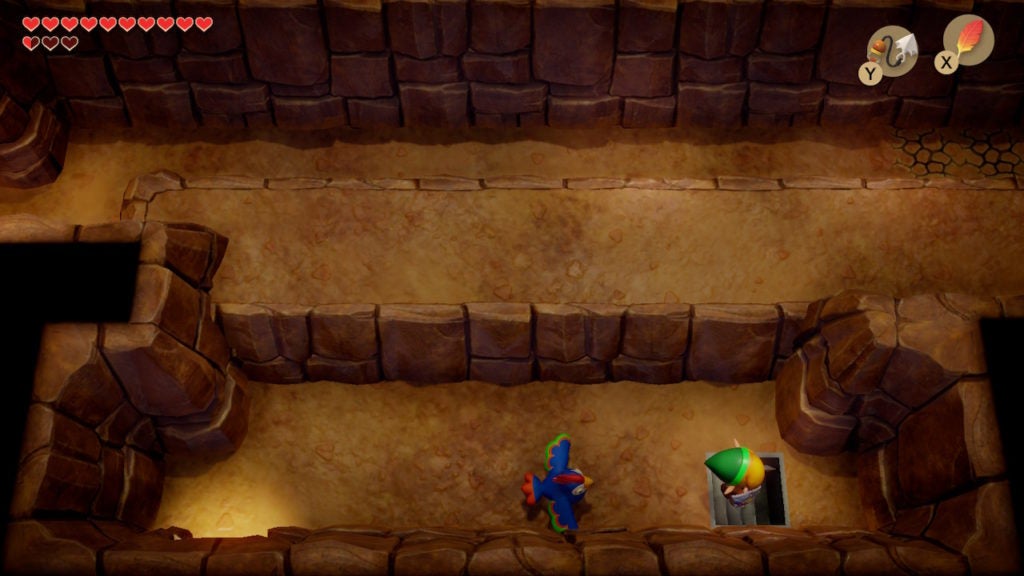 Link and blue rooster traveling east through another small corridor in a cave.