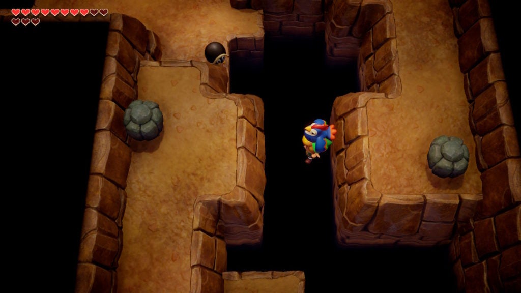 Link flying across a pit with the blue rooster's help.