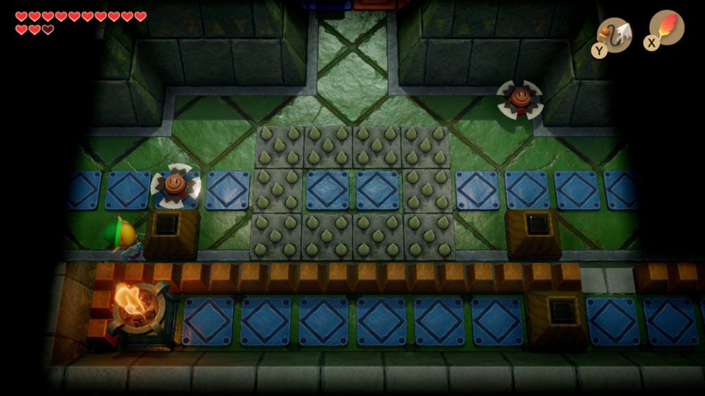 Link in a room with 2 Blade Traps and some floor spikes.