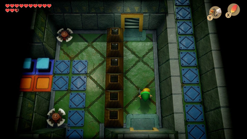 Link in a slim room with a staircase leading upwards.