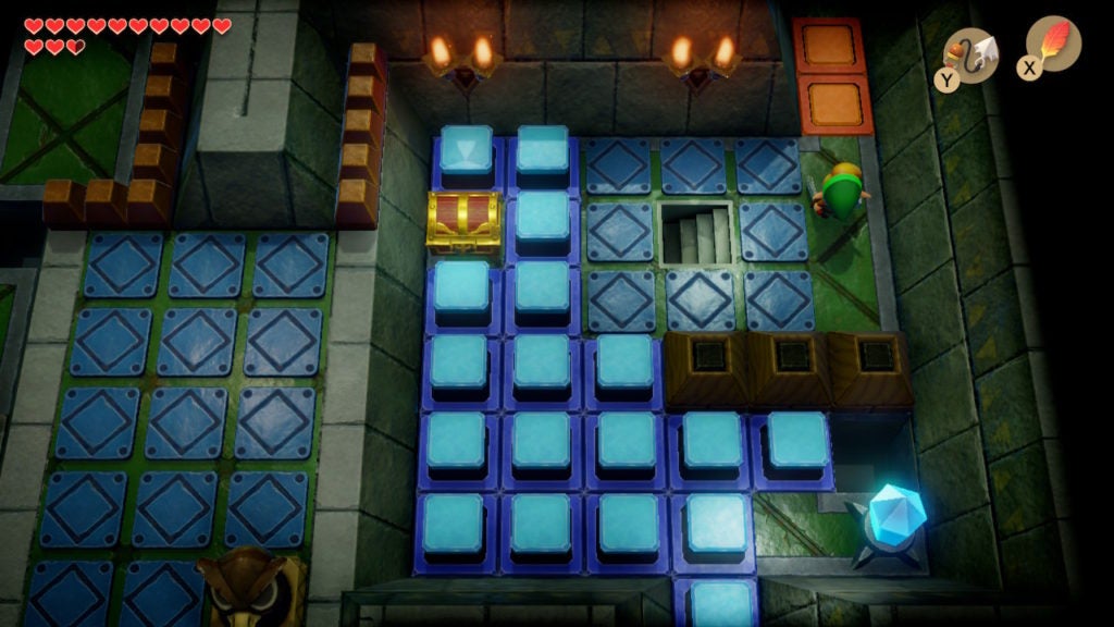 Link in a room with a staircase and a chest surrounded by blue switch blocks.
