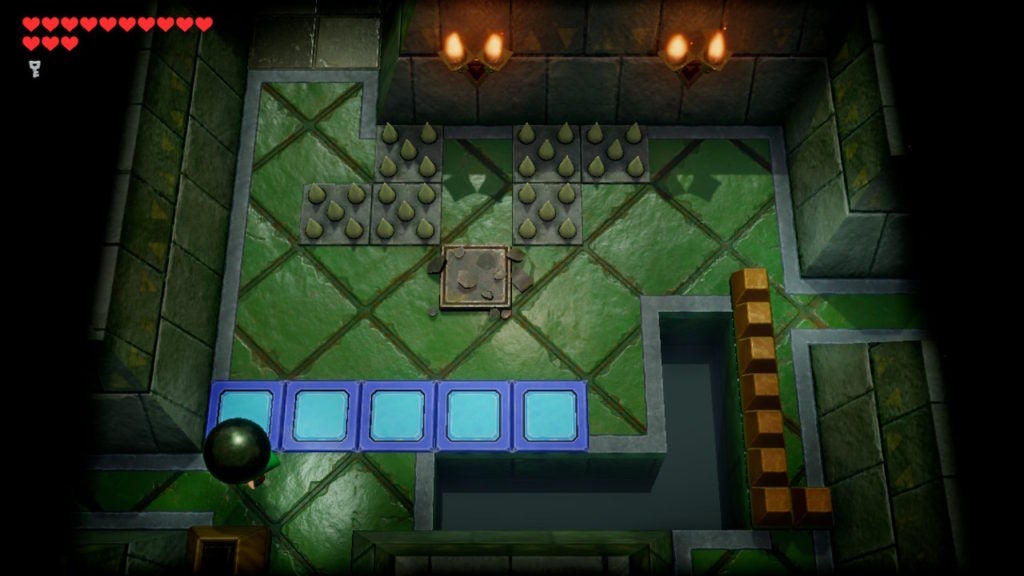 Link carrying a large black stone in the southwest corner of a room.