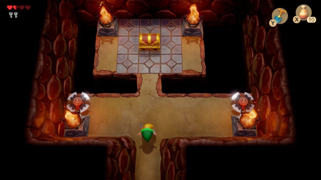 A room with a chest and 2 blade trap enemies guarding it.