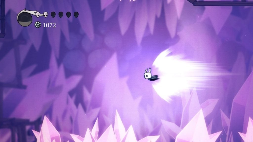 The Knight dashing across a chasm in Crystal Peak using Crystal Heart.