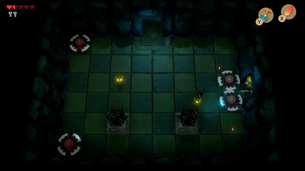 A room with 2 unlit torches in the middle, 4 blade traps around the sides, and 2 keese in the middle.