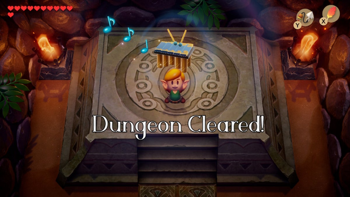 Link holding up the Wind Marimba with the text "dungeon cleared!" is underneath him.
