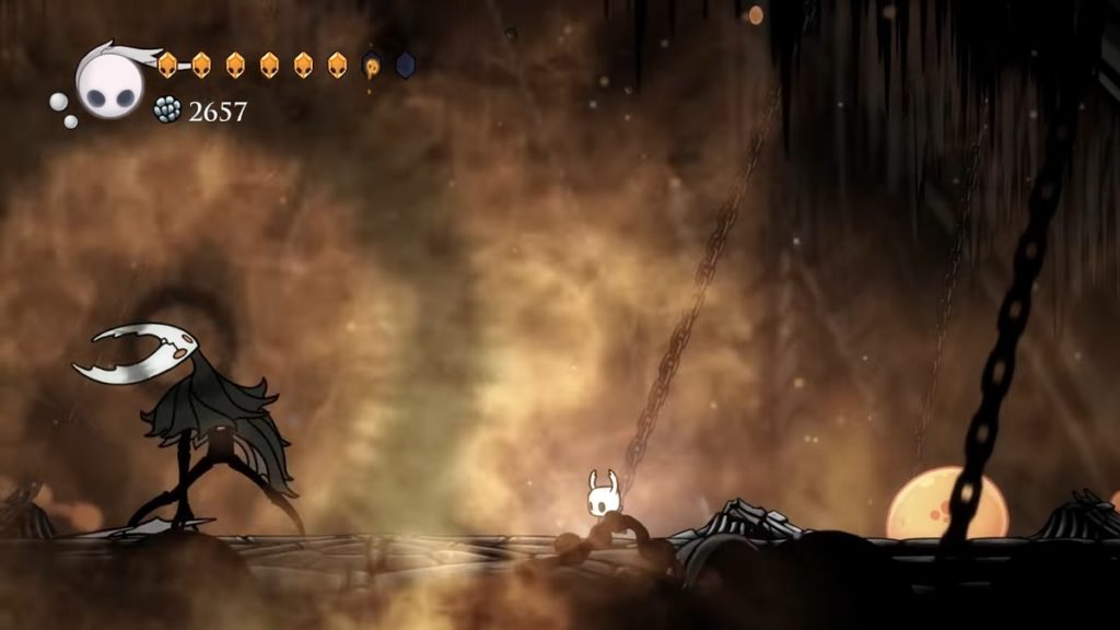 Fighting the Hollow Knight.