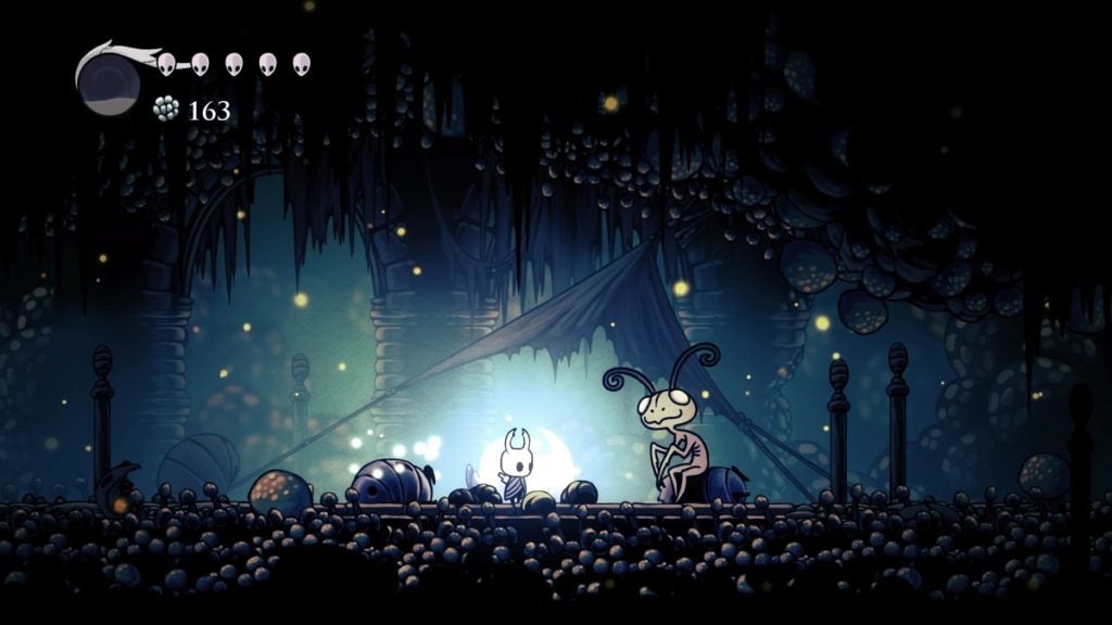 Meeting the Leg Eater in Hollow Knight.