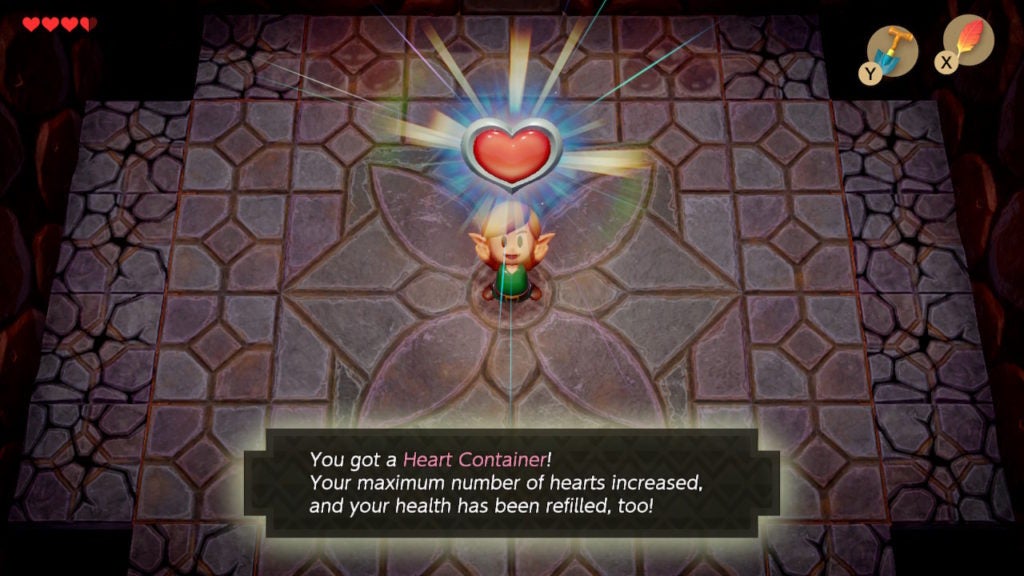 Link holding a Heart Container over their heads ad the game tells the player that it will increase their maximum number of Hearts by 1.