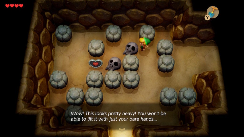 Link unable to lift up a skull on the ground that's blocking the way to a heart piece.