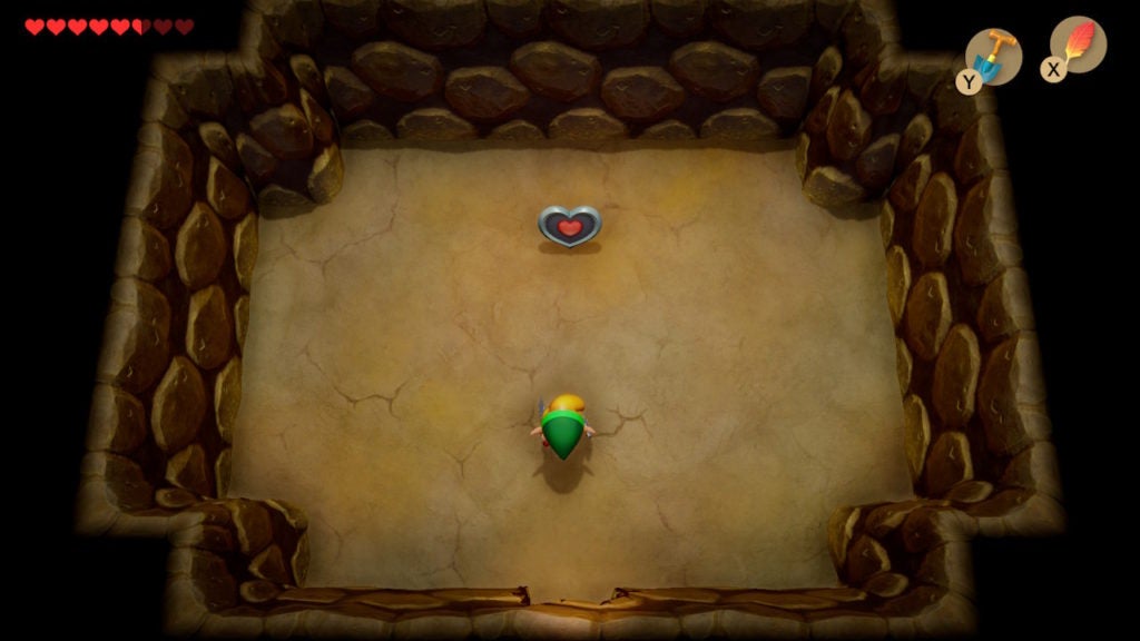 Link finding a heart piece in the hidden underground room below the quicksand pit.