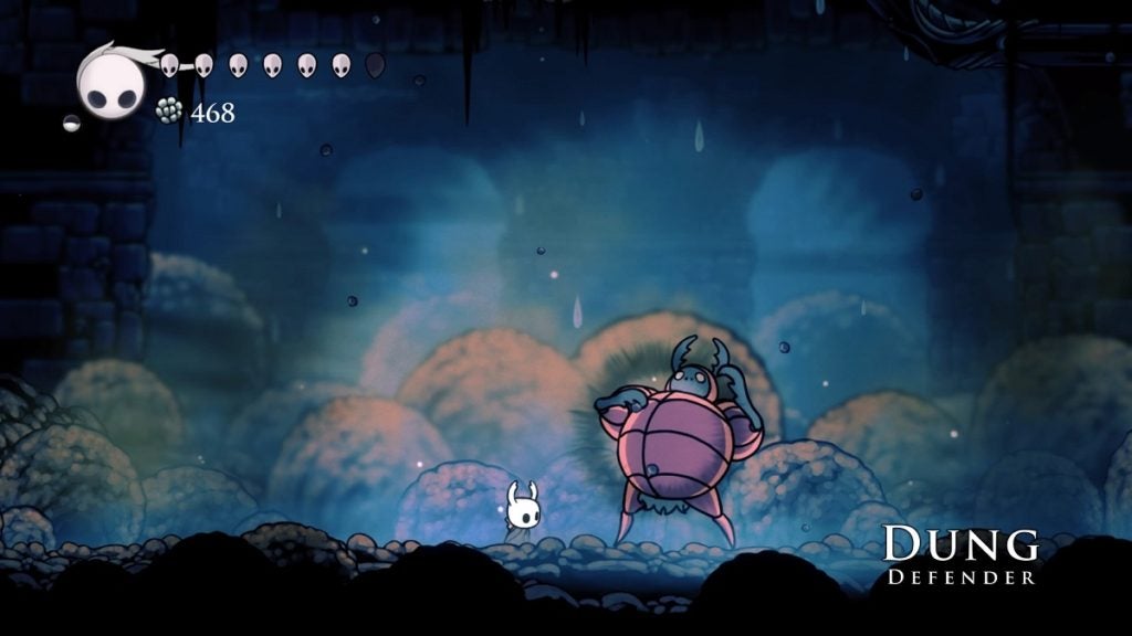 The Knight facing the Dung Defender from Hollow Knight.