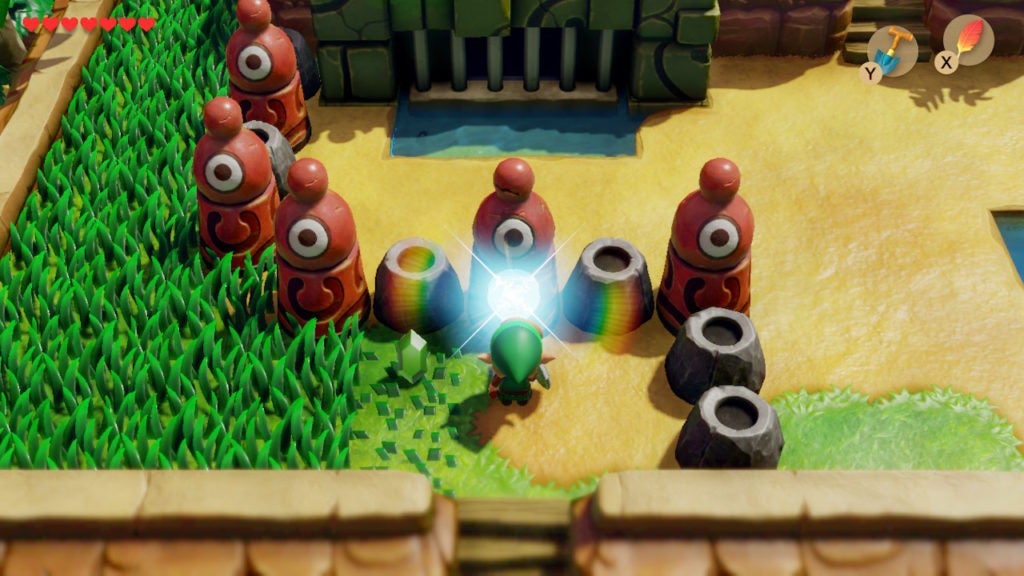 Link using the slime key to unlock the slime keyhole in front of the dungeon.